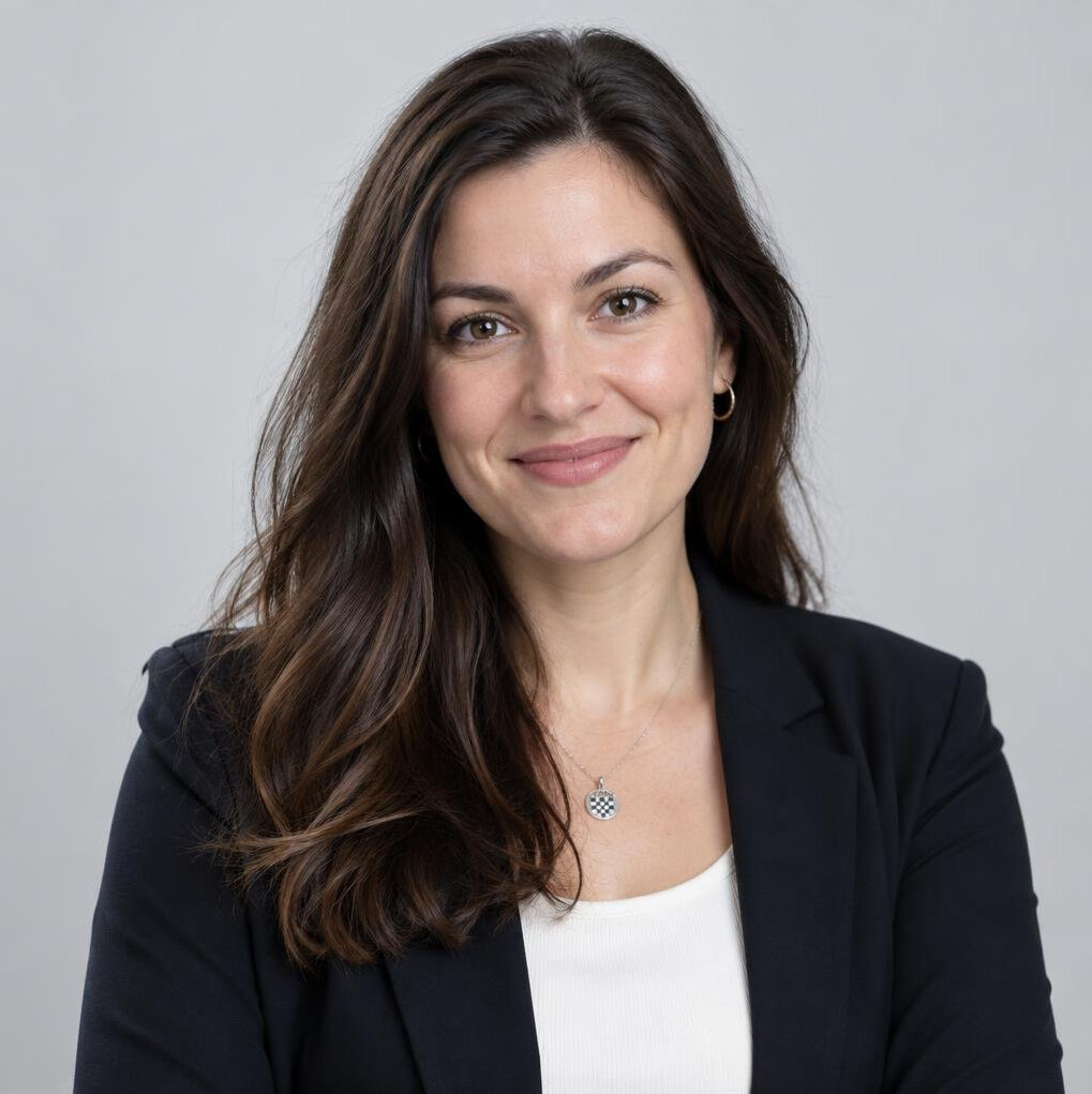 Portrait of a Croatian female software architect smiling in an office